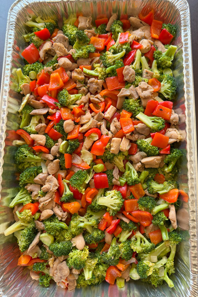 Chicken Stir-fry: boneless chicken thigh, broccoli, red bell pepper, onion, garlic, teriyaki sauce.