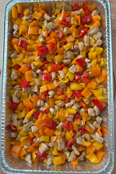 chicken stir-fry: boneless chicken thigh, red bell pepper, orange bell pepper, onion, garlic, soy sauce.